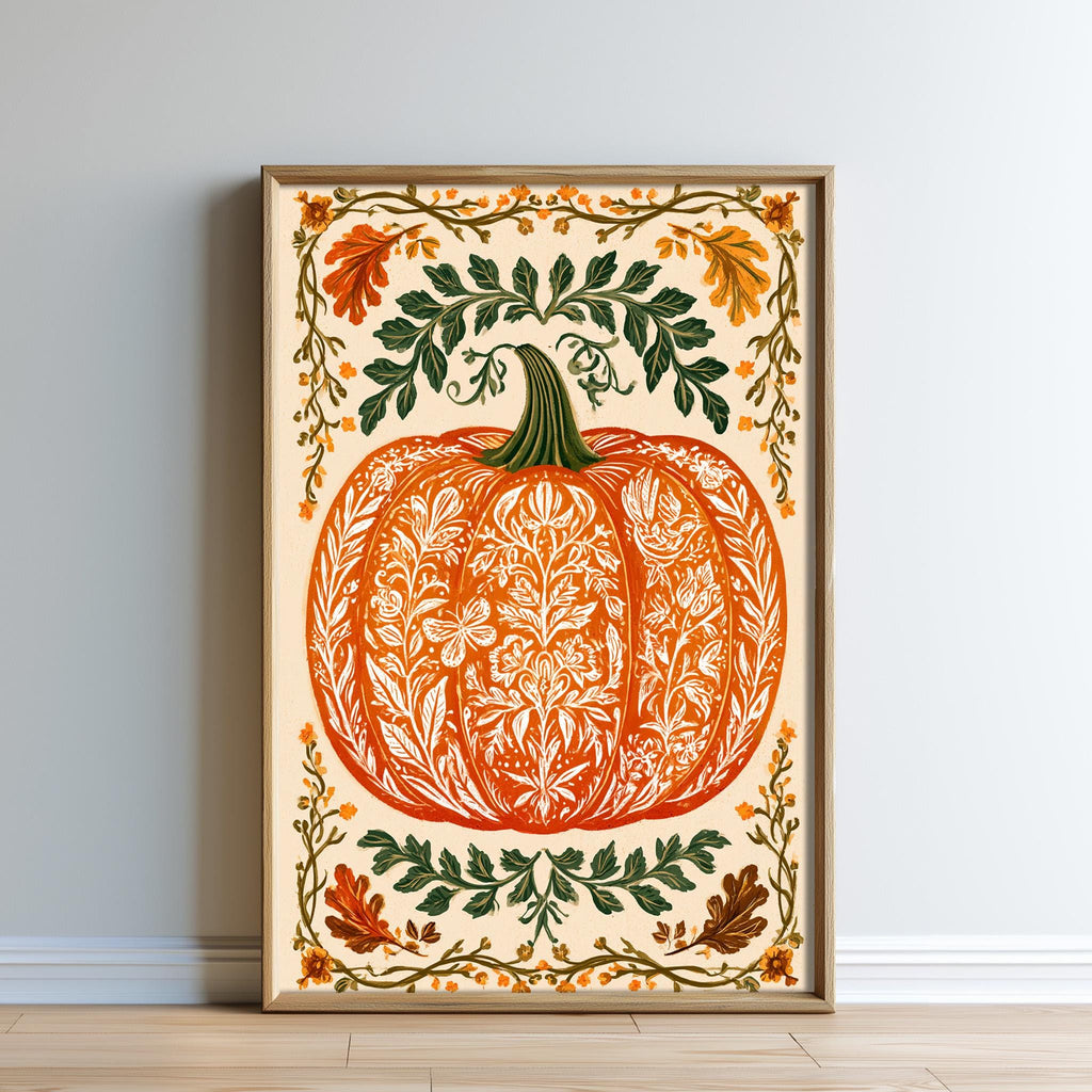 A framed print depicting an ornate pumpkin with intricate floral patterns and leaves surrounding it, set against a light background.