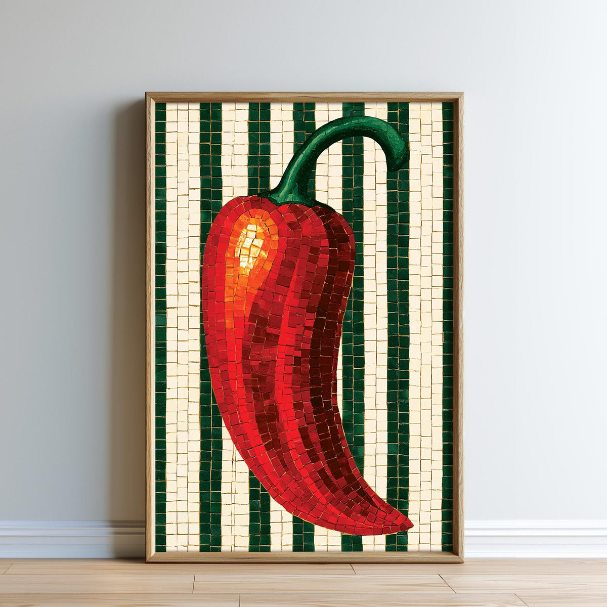 A framed mosaic artwork depicting a red pepper on a white and green striped background.