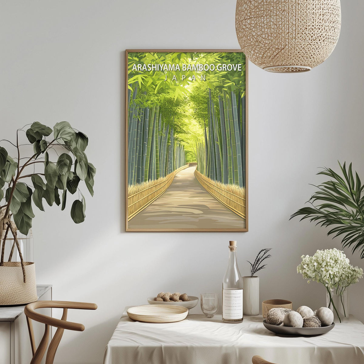 a framed poster of a bamboo path in a lush, green environment, hanging on a wall above a dining table with various decorative items and plants.