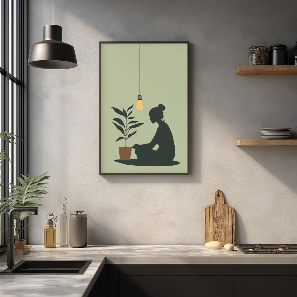 a kitchen scene with a framed illustration of a person sitting on the floor next to a potted plant, hanging on the wall above a countertop with various kitchen items.