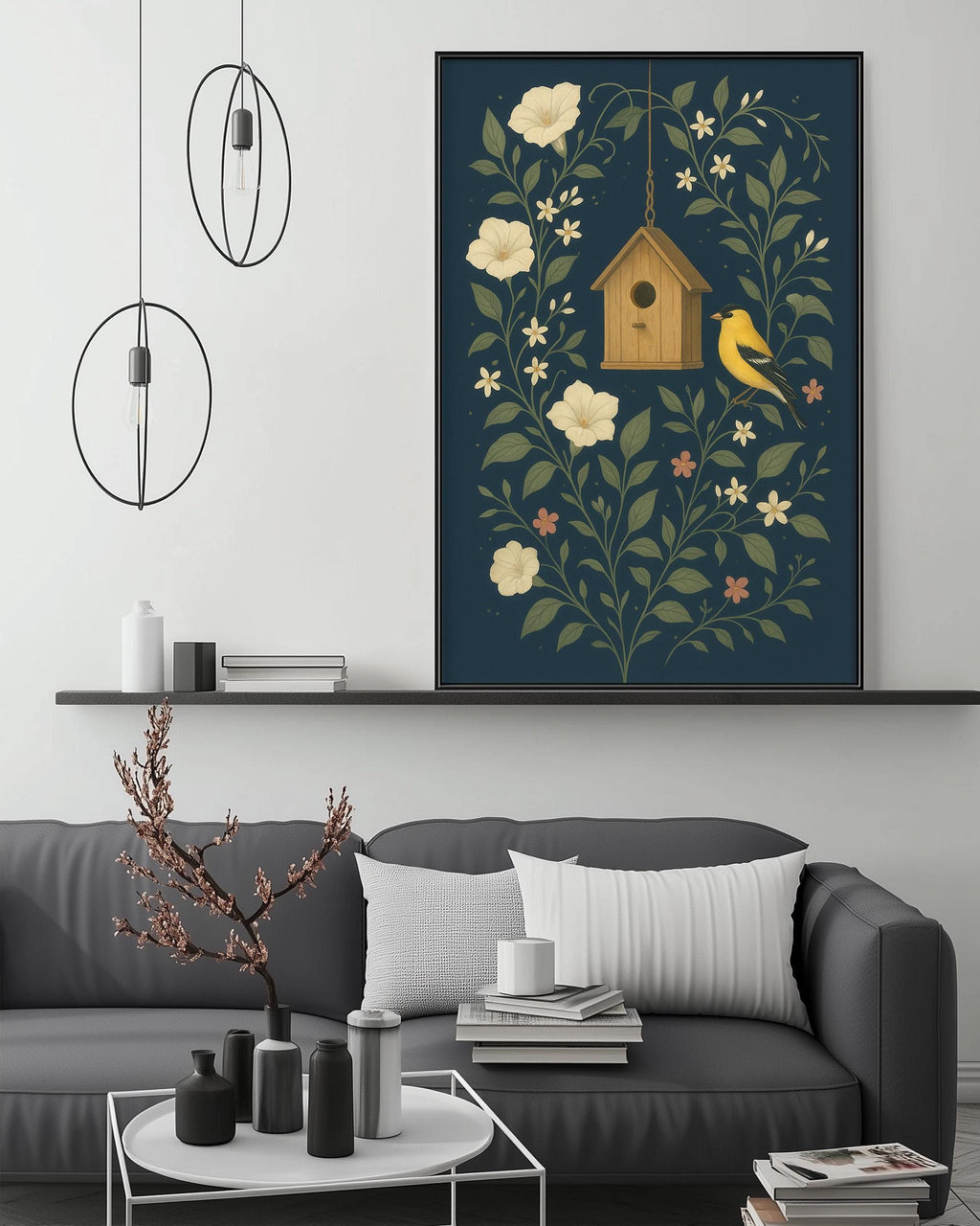 a cozy living room with a gray sofa, a coffee table, and a large framed print of a birdhouse surrounded by flowers and leaves hanging on the wall above it.