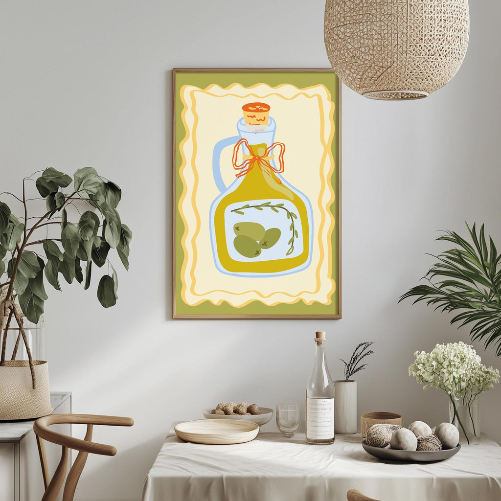 a dining table with a white tablecloth, a bowl of fruit, a bottle of olive oil, and a potted plant. A framed illustration of a bottle of olive oil is hanging on the wall above the table.