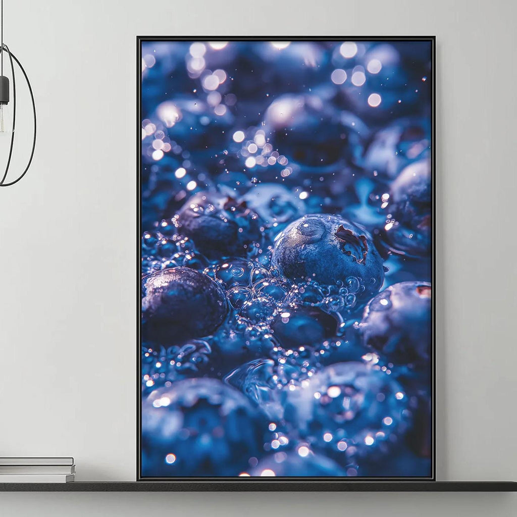 a modern living room with a gray sofa, a coffee table, and a large framed print of blueberries hanging on the wall above the sofa.