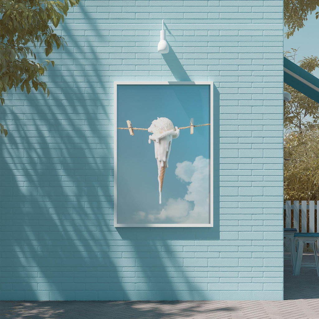 a large framed picture of an ice cream cone hanging from a clothesline against a blue brick wall.