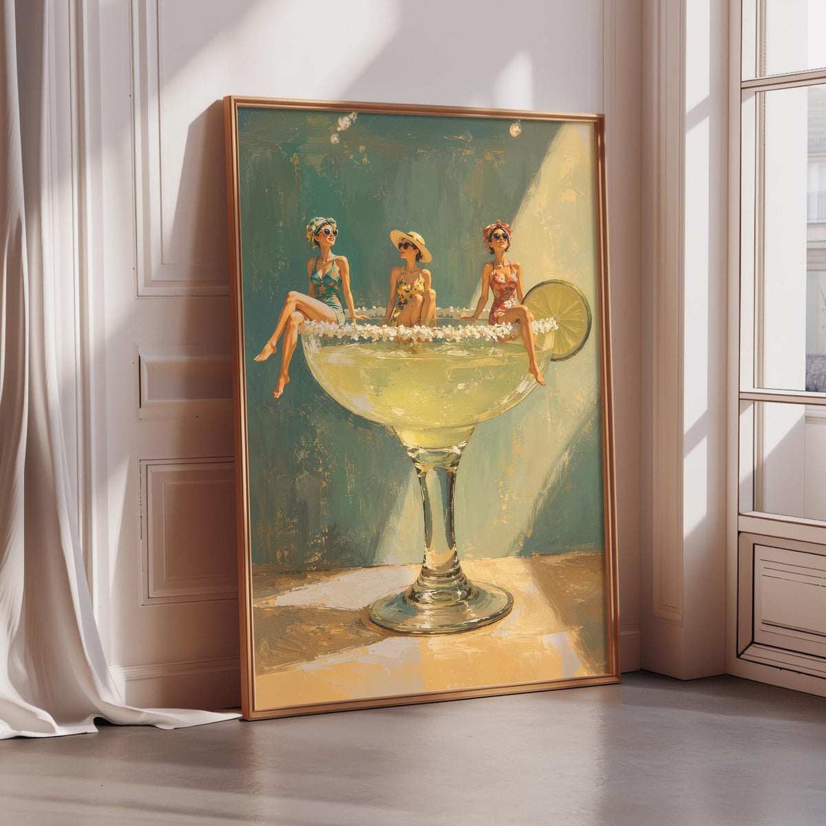 A framed painting depicting three women sitting in a margarita glass, with a lime wedge in the glass.