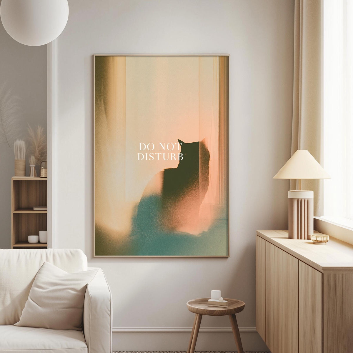 a living room with a white sofa, a wooden side table, and a framed poster with the text "DO NOT DISTURB" on the wall.