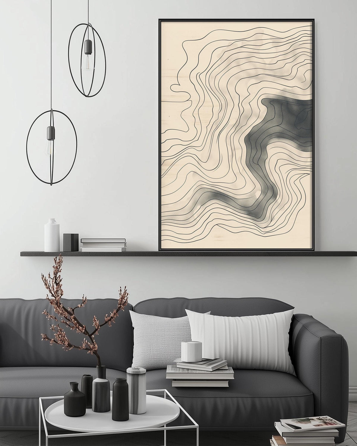 a modern living room with a gray sofa, a coffee table, and a large abstract painting hanging on the wall above the sofa.