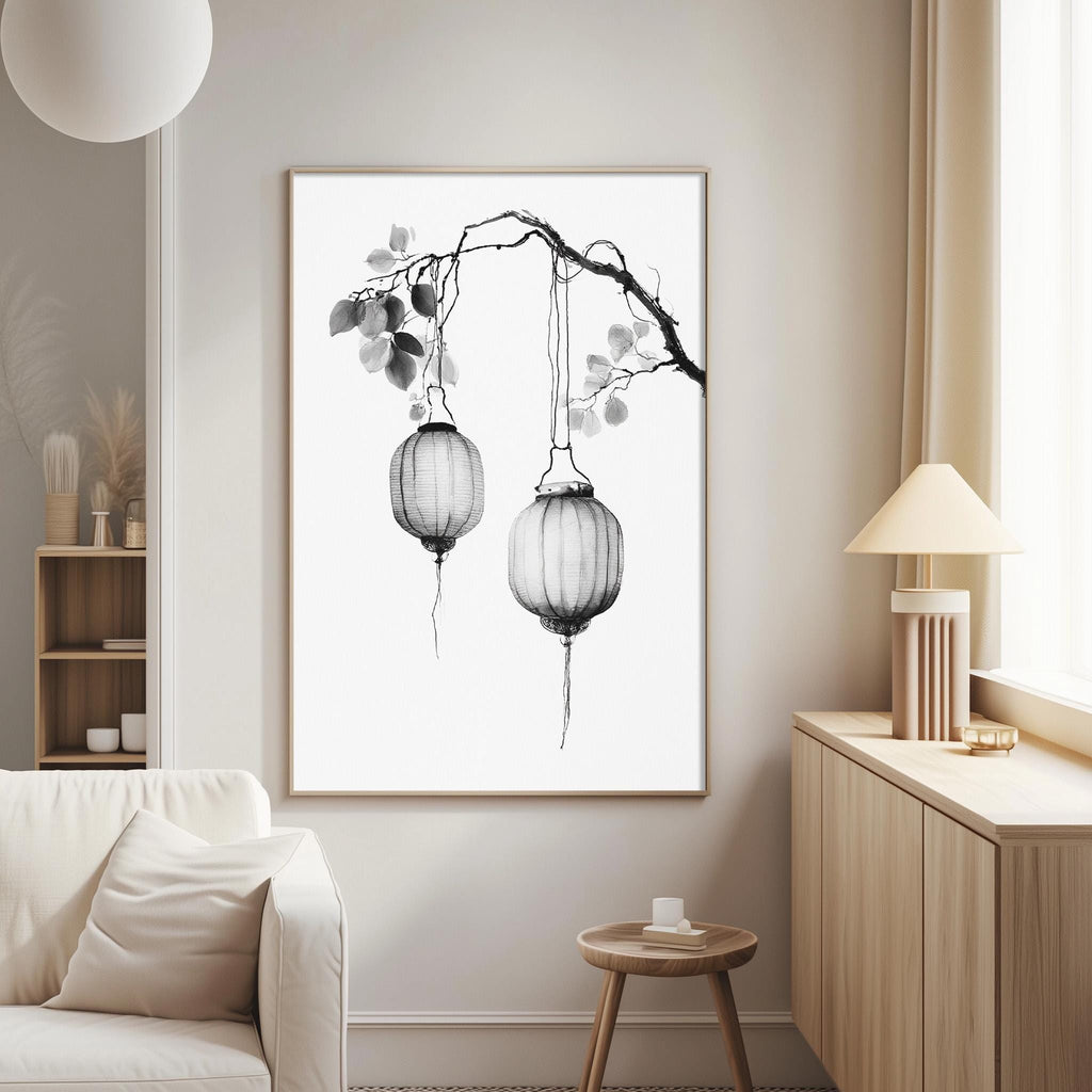 a living room with a white sofa, a wooden side table, and a framed artwork depicting two hanging lanterns on a branch.