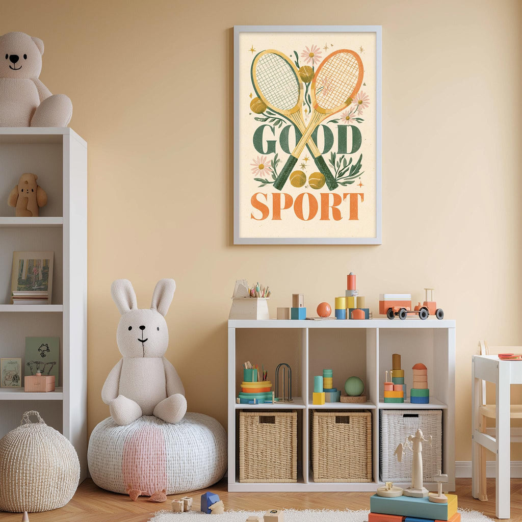 A child's bedroom with a white bookshelf, a stuffed rabbit, and a framed poster with the text "GOOD SPORT" on the wall.
