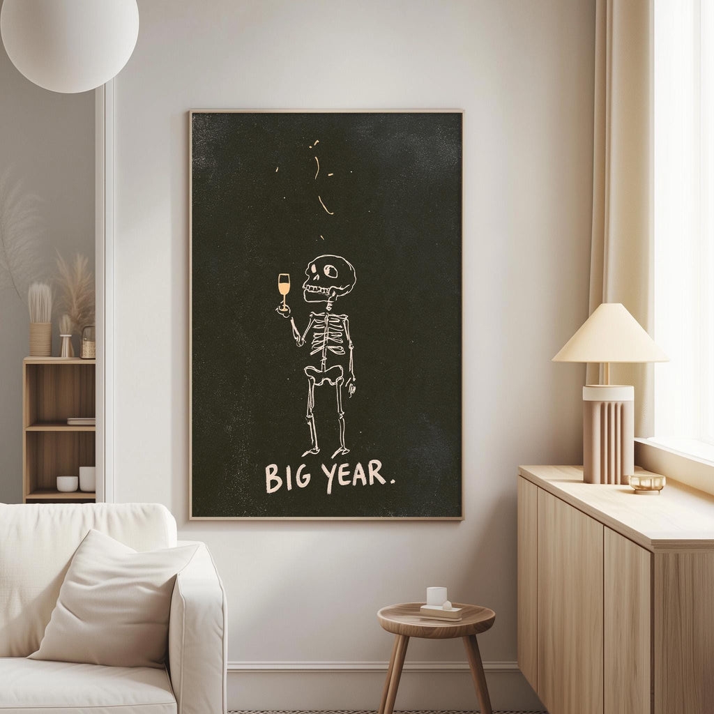 a living room with a large black and white poster of a skeleton holding a wine glass, accompanied by the text "BIG YEAR."