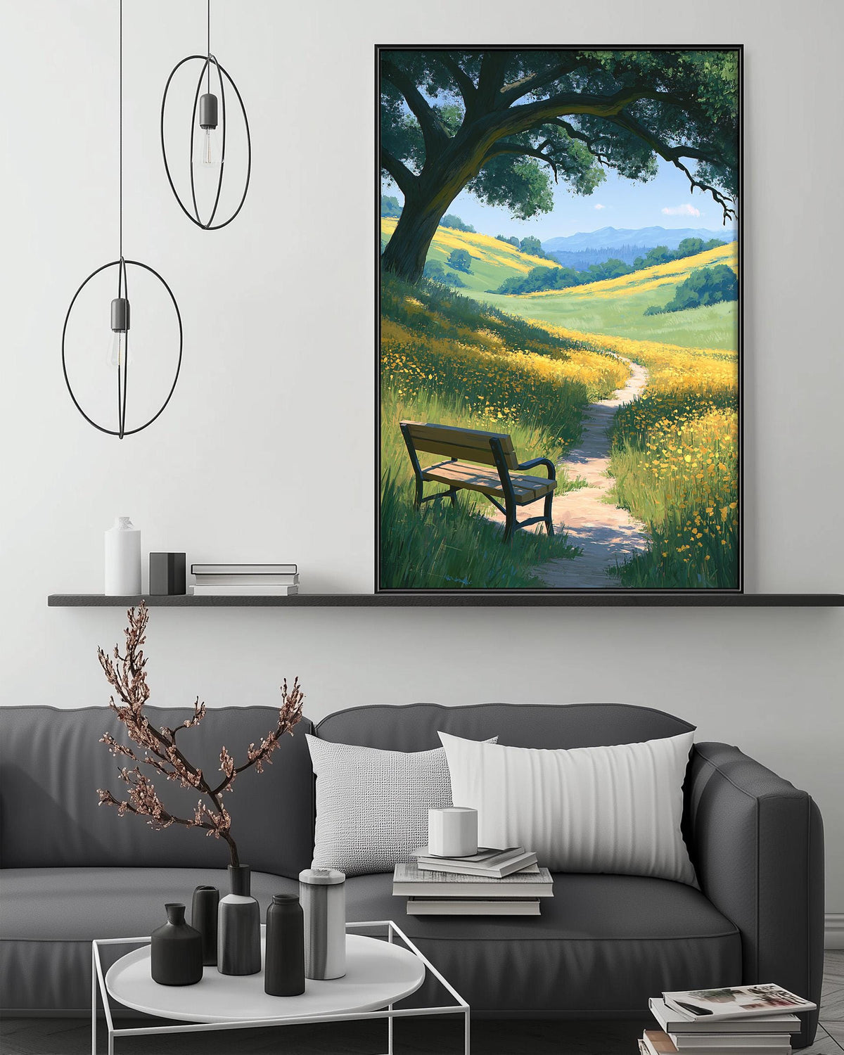 a cozy living room with a gray sofa, a coffee table, and a large painting of a bench under a tree in a field. The painting is hanging on the wall above the sofa, creating a serene and inviting atmosphere in the space.