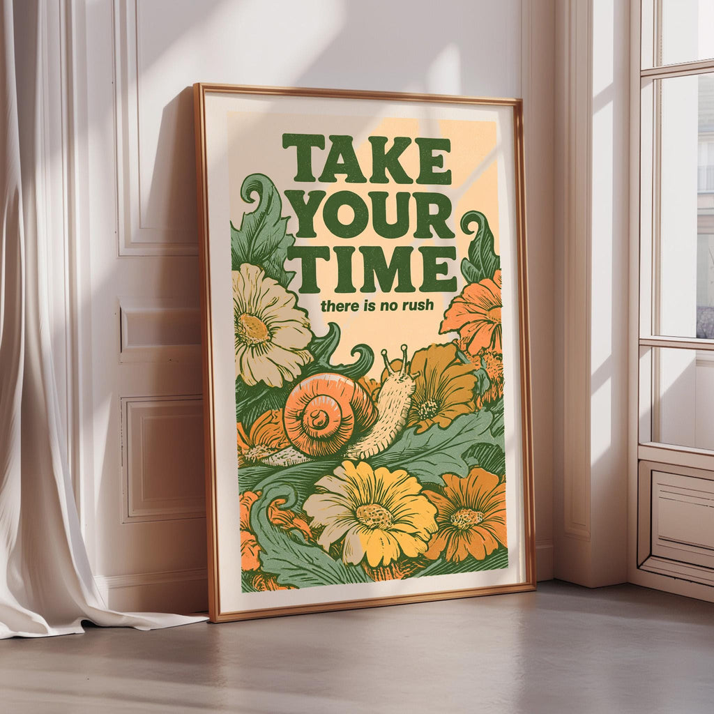 a framed poster with a floral design and the text "TAKE YOUR TIME there is no rush" on it.
