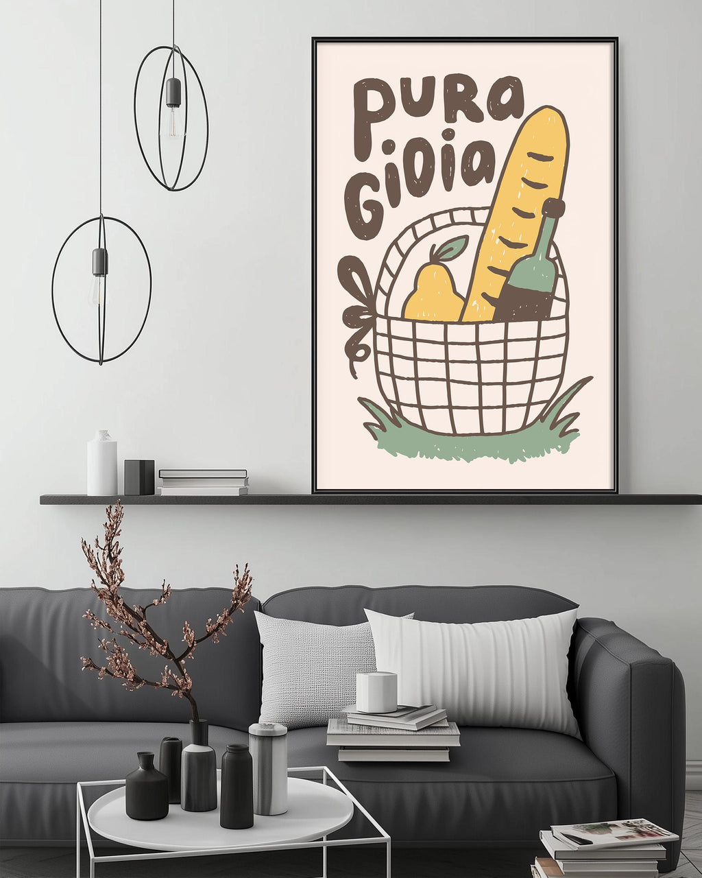a cozy living room with a gray couch, a coffee table, and a framed poster on the wall. The poster depicts a basket filled with various food items, including a loaf of bread, a pear, and a bottle.
