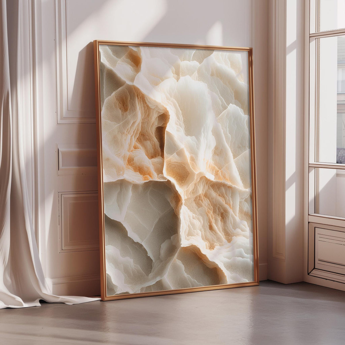 a large, framed picture of a marble-like stone texture, with a warm, earthy color palette of beige, orange, and white. The picture is displayed in a room with a window, creating a cozy and inviting atmosphere.