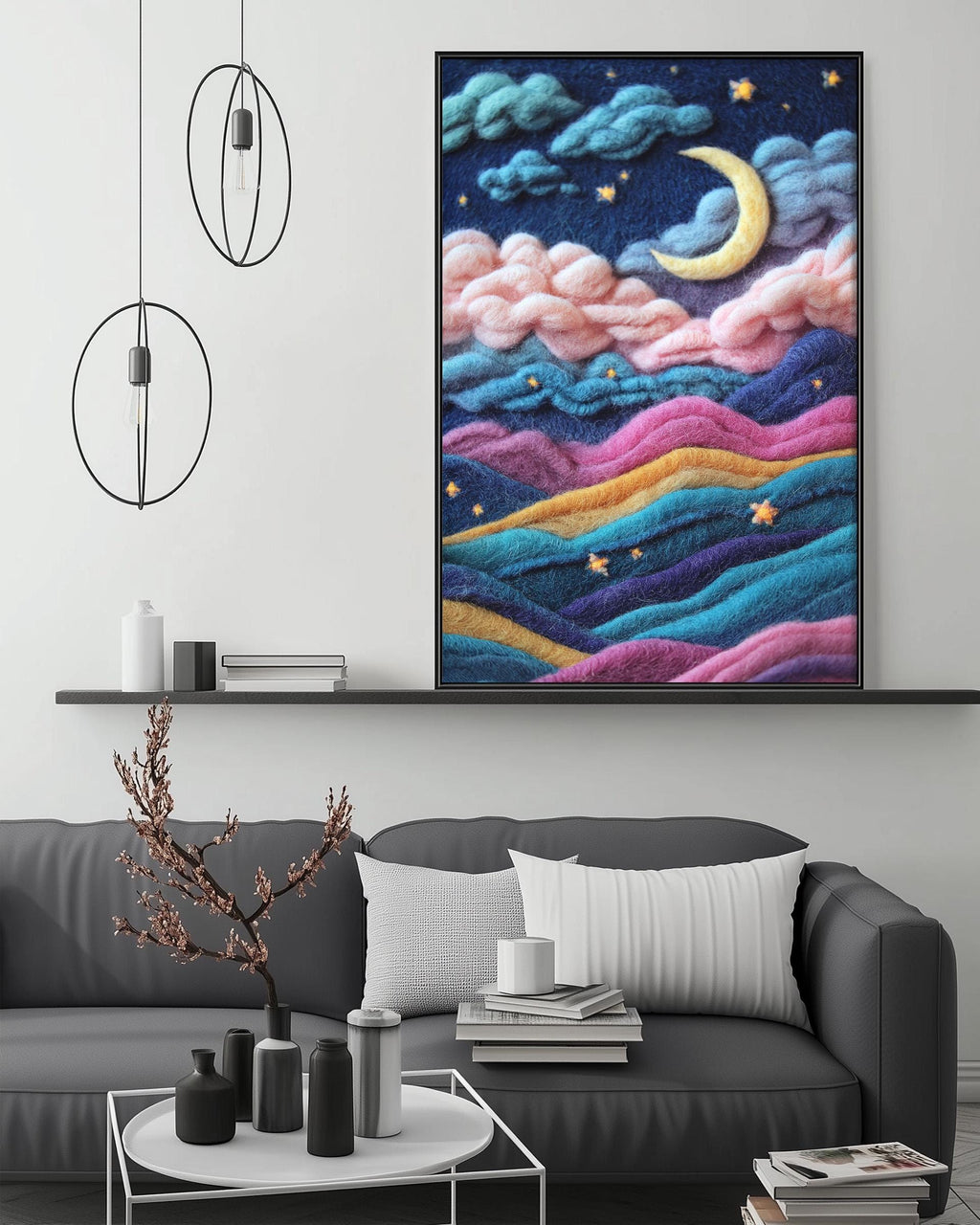 a cozy living room with a gray sofa, a coffee table, and a large framed painting depicting a night sky with a crescent moon, clouds, and stars.