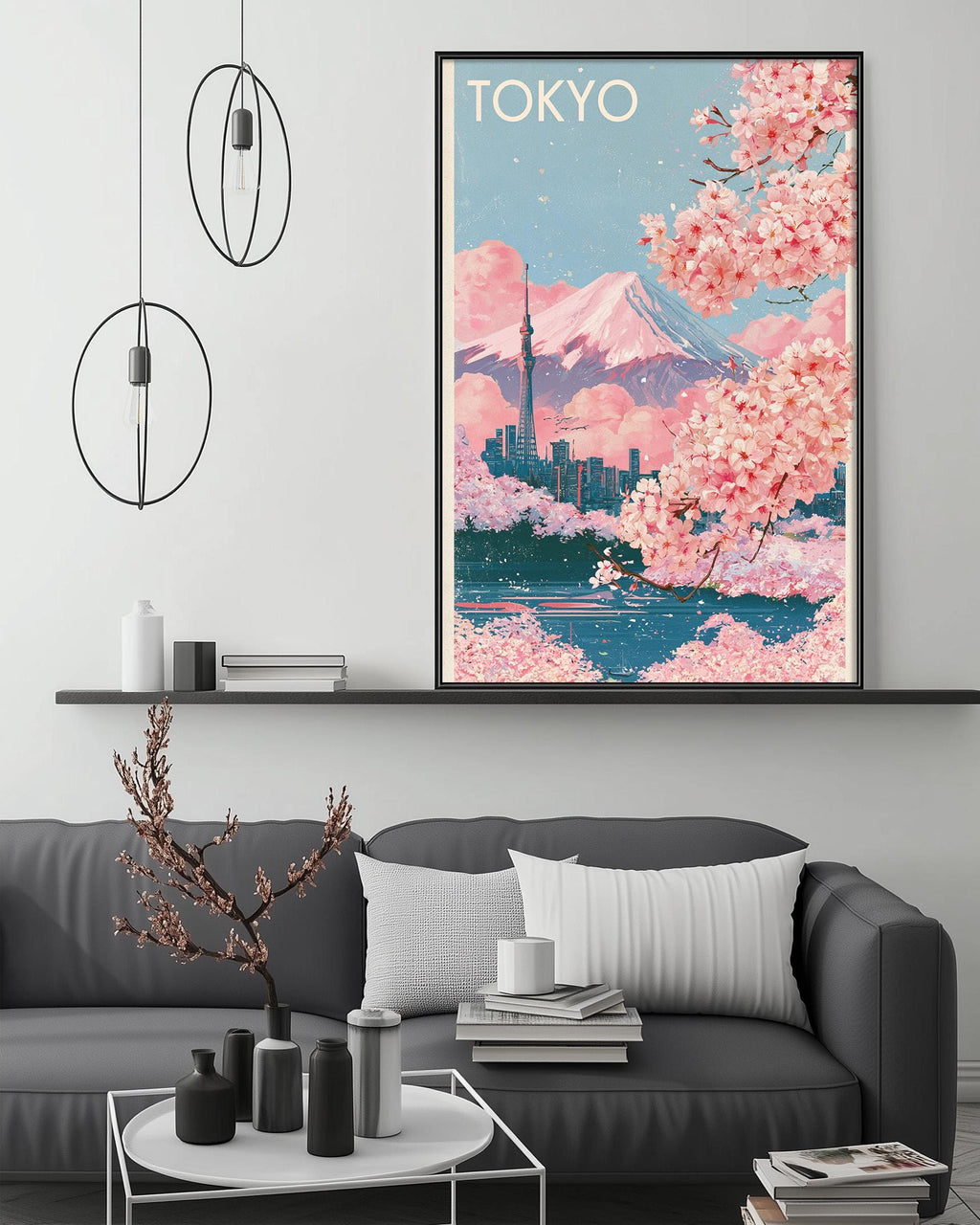 a cozy living room with a gray sofa, a coffee table, and a framed poster of Tokyo displayed on the wall above the sofa.