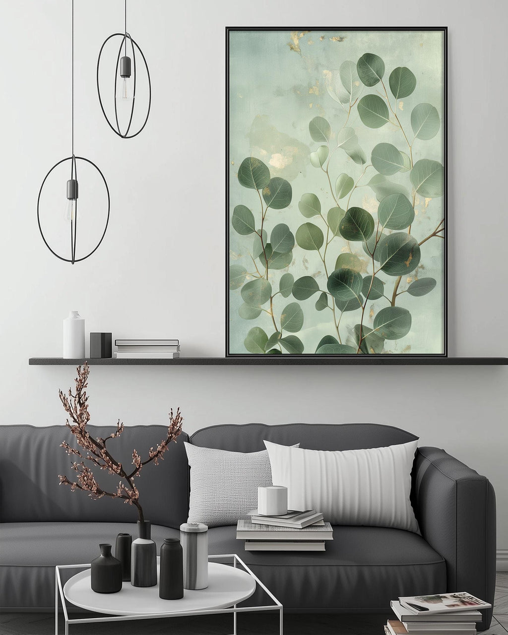 a modern living room with a gray sofa, a coffee table, and a large framed print of green leaves on the wall above the sofa.