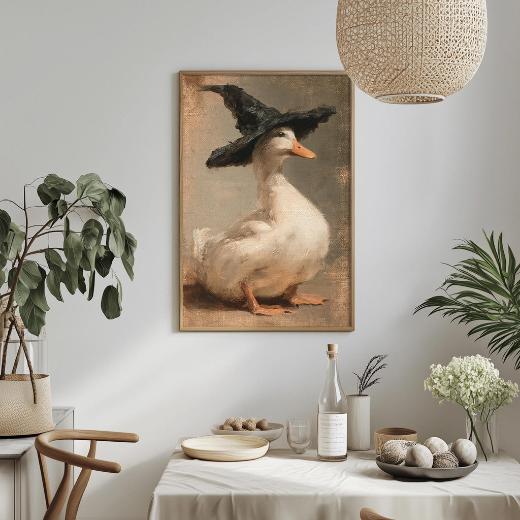 a painting of a duck wearing a black hat, hanging on a wall above a table with various decorative items and plants.