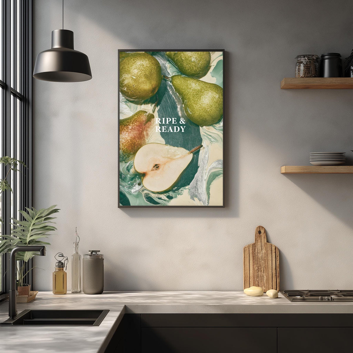 a kitchen counter with a framed poster of pears hanging on the wall above it. The poster has a vibrant green and white color scheme, and the text "Ripe & Ready" is prominently displayed.