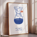 A framed poster with a blue coffee maker illustration and the text "life happens, coffee helps" on a white background.