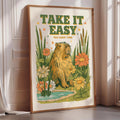 a framed poster with a beaver surrounded by flowers and plants, with the text "TAKE IT EASY YOU HAVE TIME" displayed prominently.