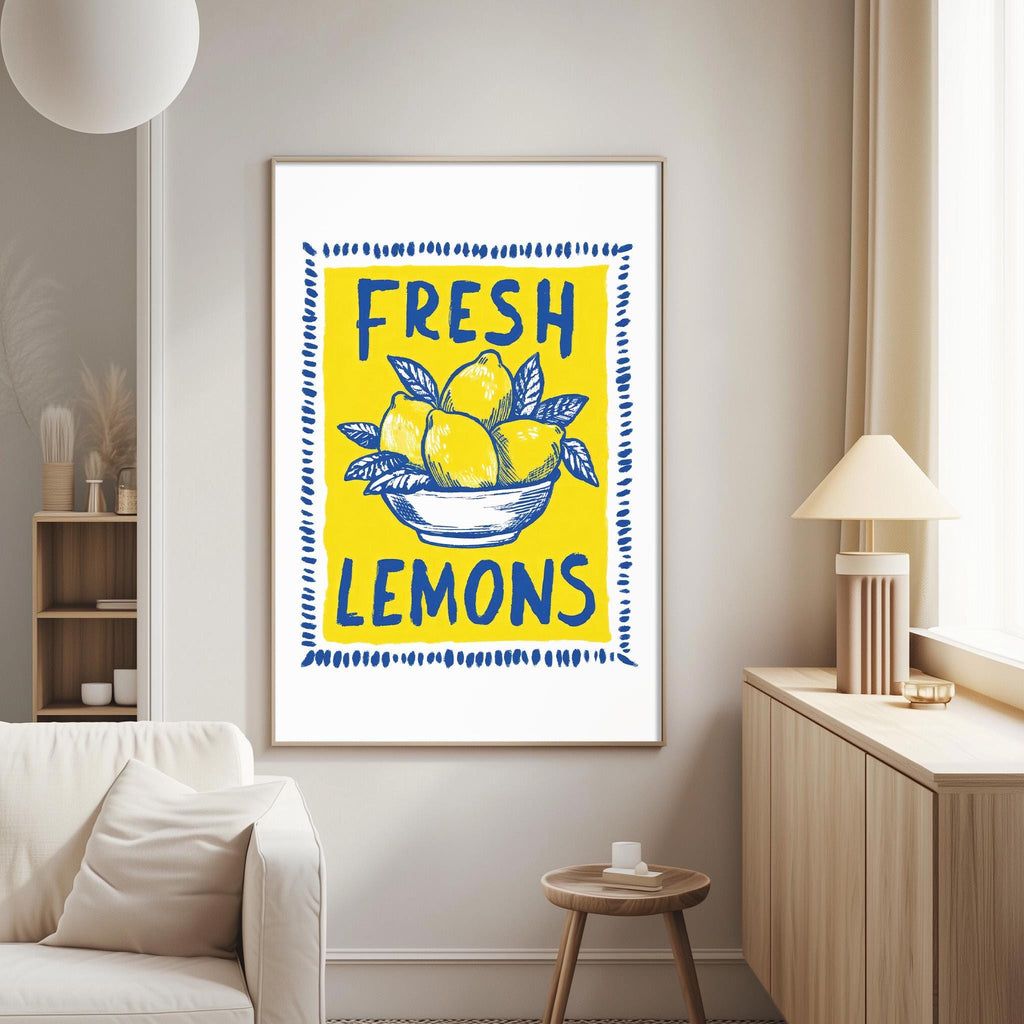 a framed poster with a yellow background and blue text that reads "FRESH LEMONS".