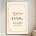 a poster with the text "CREATE EXPLORE LEARN" in a light beige color, hanging on a wall in a living room setting.