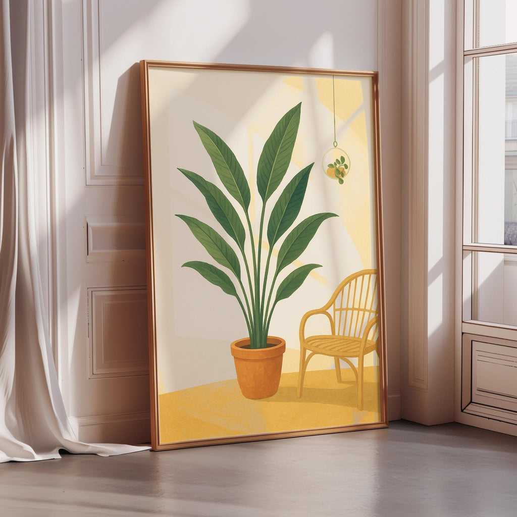 A large framed painting depicting a potted plant with large green leaves, placed on a wooden floor next to a yellow chair.