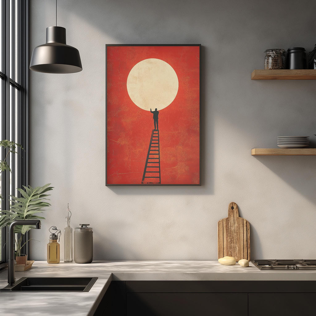 a kitchen counter with a wooden cutting board, a metal container, and a glass bottle. Above the counter, there is a framed artwork depicting a person climbing a ladder towards a large white circle, which appears to be a sun or moon.