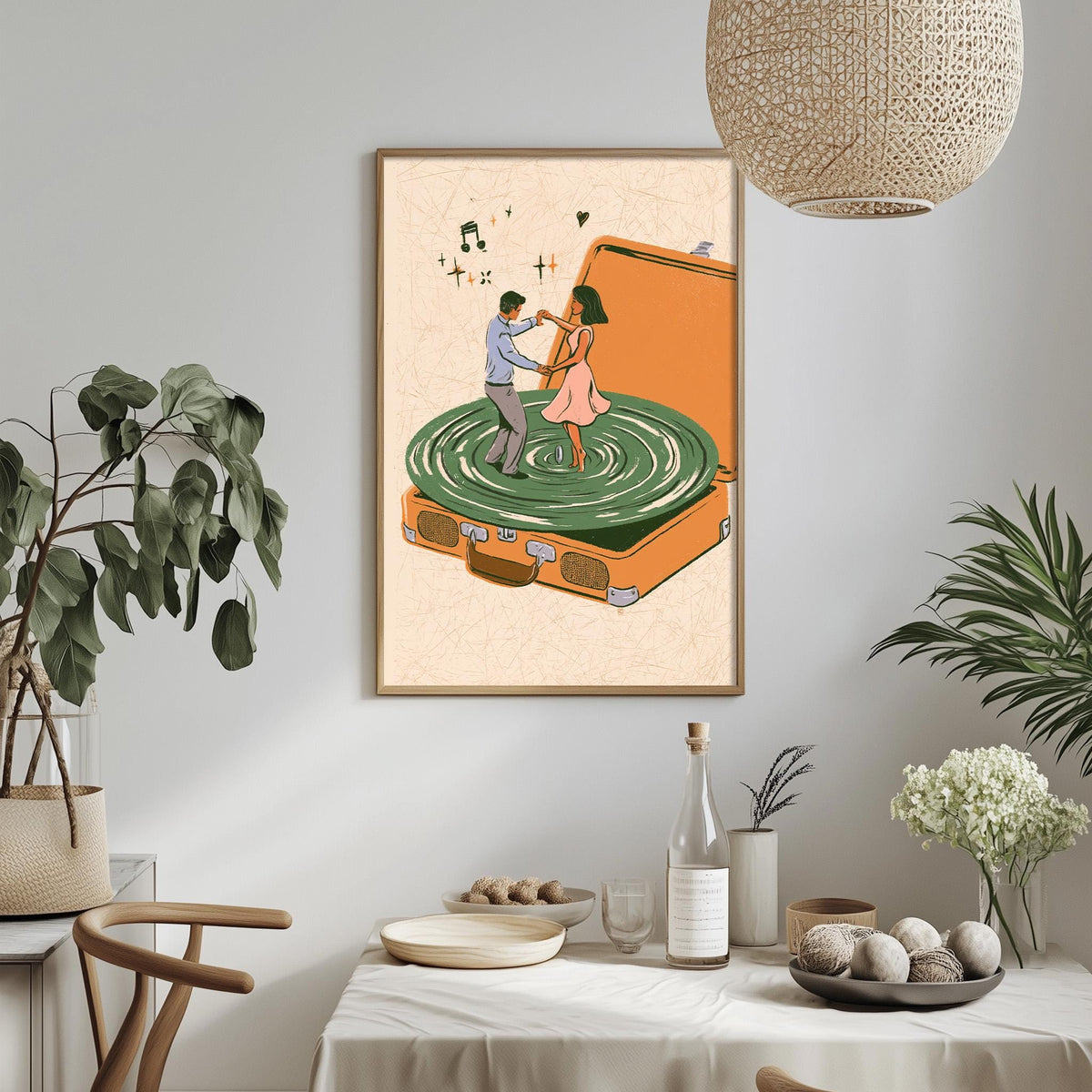 a framed illustration of a man and a woman dancing on a turntable, surrounded by various decorative elements such as plants, vases, and a table setting.
