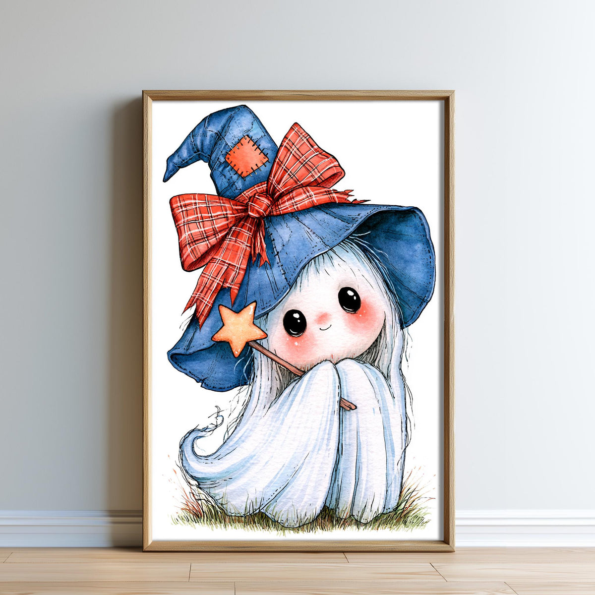 A framed illustration of a small, white ghost with large eyes and a pointed hat, sitting on grass and holding a star.