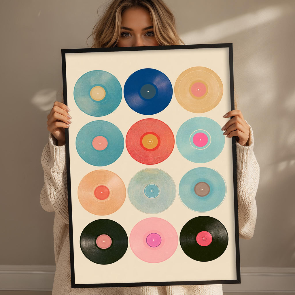 A woman is holding up a framed collage of colorful vinyl records, showcasing a variety of vibrant designs.