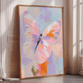 A large, colorful painting of a butterfly is displayed on a wall in a room with a window.