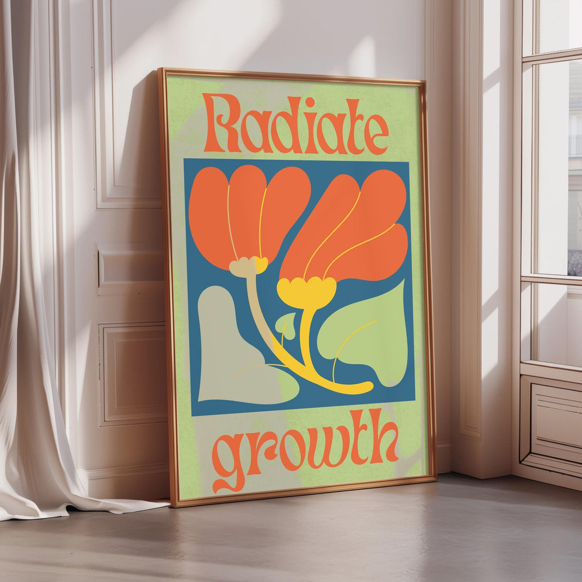 A framed poster with the text "RADIATE GROWTH" and an illustration of a flower with orange petals and green leaves.