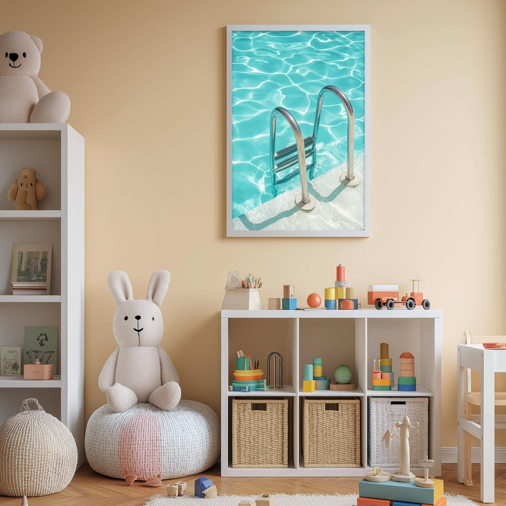 A child's bedroom with a white bookshelf, a stuffed rabbit, and a toy train. The walls are painted a light peach color, and there is a framed picture of a swimming pool with a ladder hanging above the bookshelf.