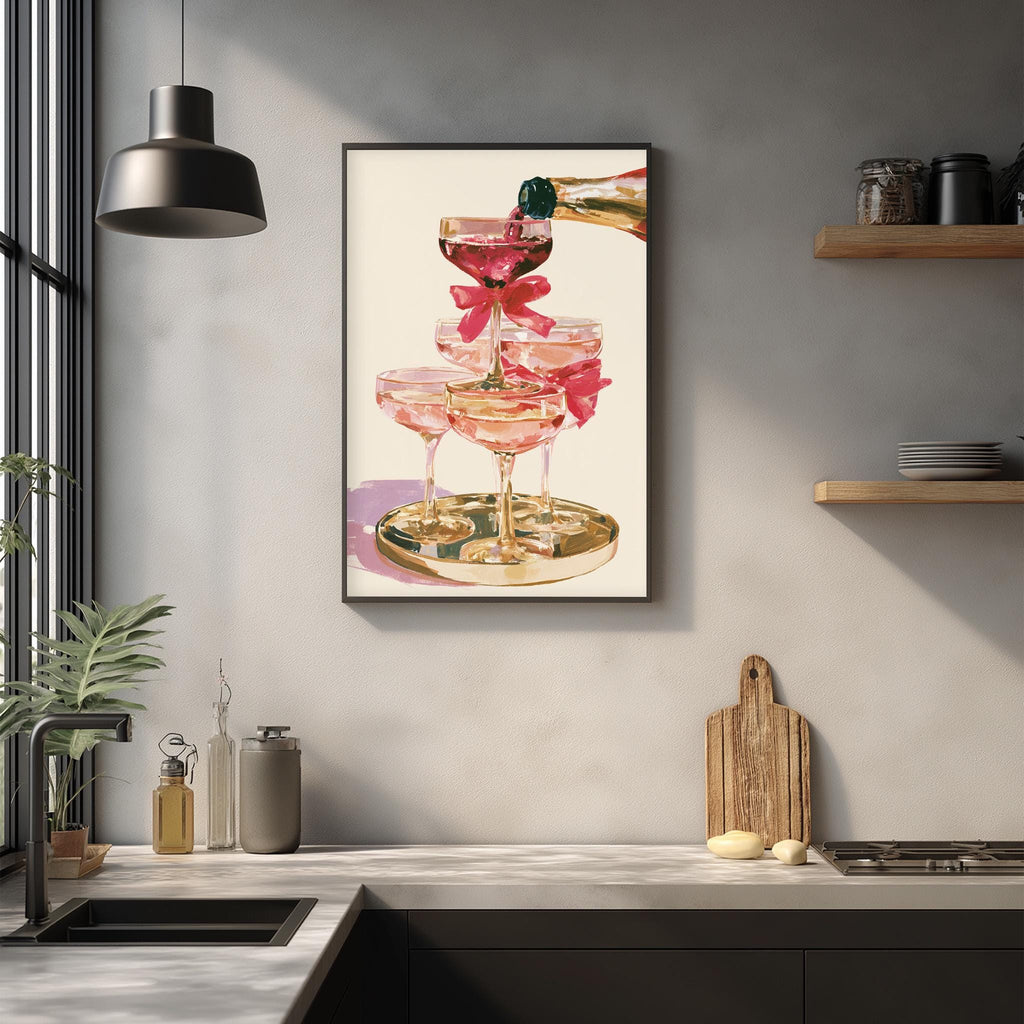 a framed painting of pink champagne glasses on a white background, with a bottle of champagne being poured into one of the glasses.