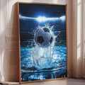 A framed image depicting a soccer ball in mid-air, surrounded by splashing water, with a stadium in the background.