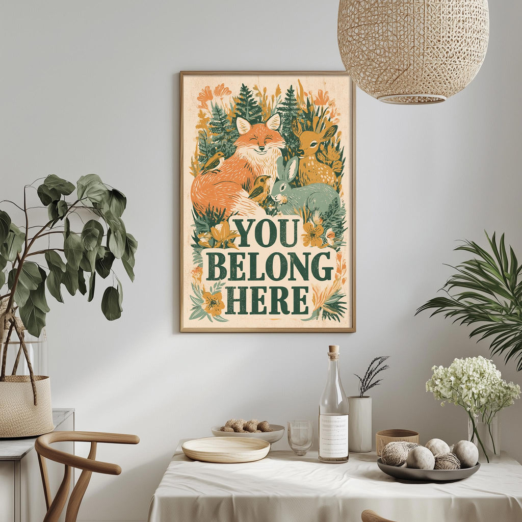 a framed poster with a vibrant illustration of animals, including a fox, rabbit, and deer, surrounded by lush greenery. The poster is hung on a wall above a dining table with various decorative items, such as potted plants, vases, and bowls.