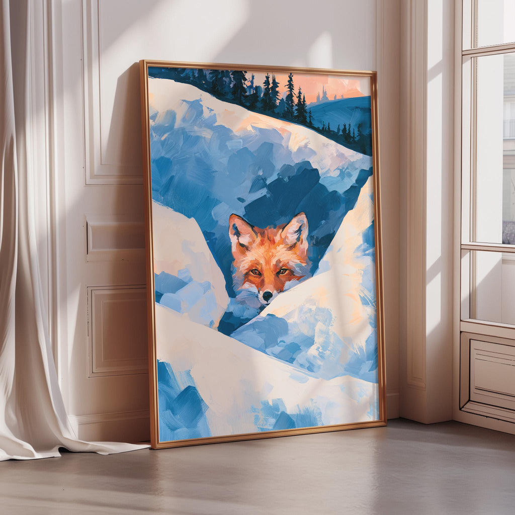 A framed painting of a red fox peeking out from a snowy landscape, with a backdrop of trees and a blue sky.