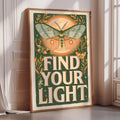 a framed poster with a butterfly and the text "Find Your Light" on it.