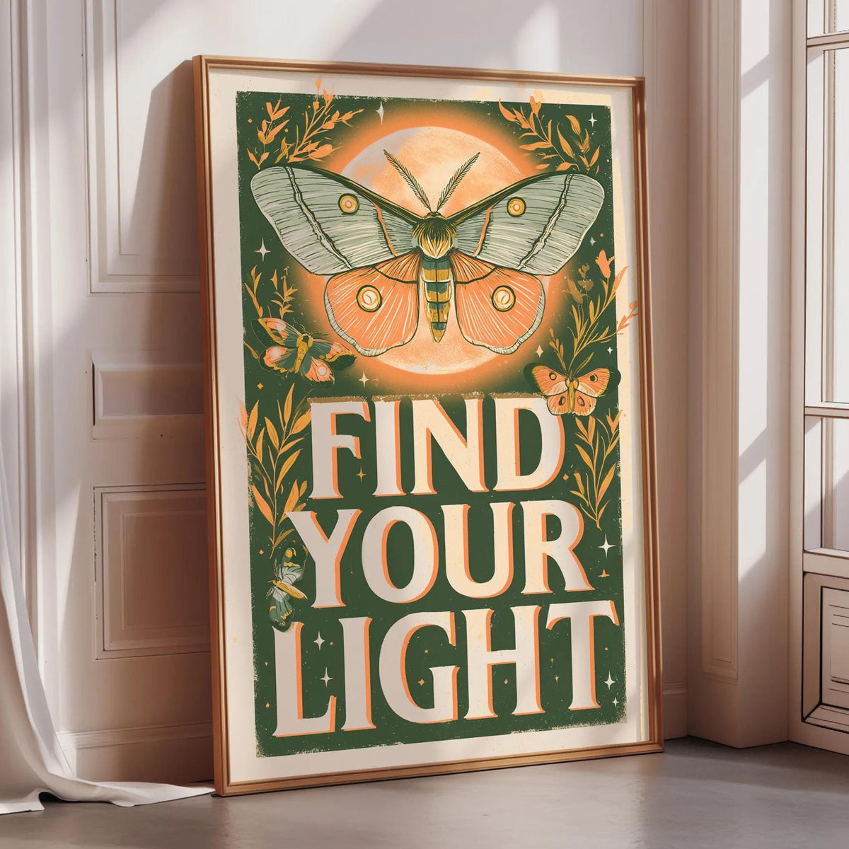 a framed poster with a butterfly and the text "Find Your Light" on it.