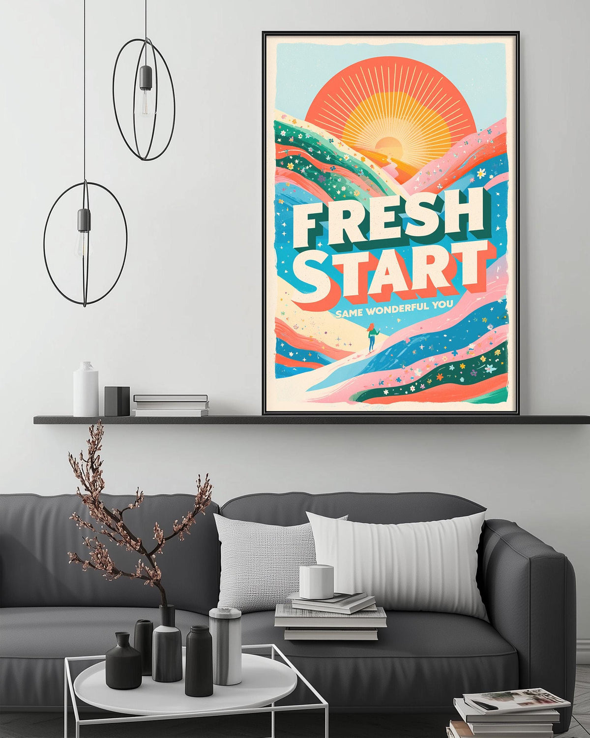 a large poster with a vibrant design hanging on a wall above a gray couch in a living room setting.