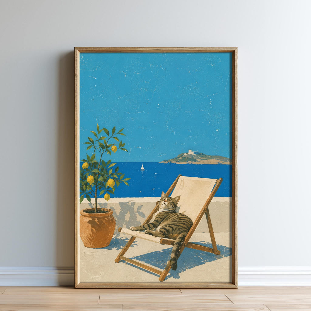 A framed painting depicting a cat lounging in a beach chair, with a potted plant and a sailboat visible in the background.