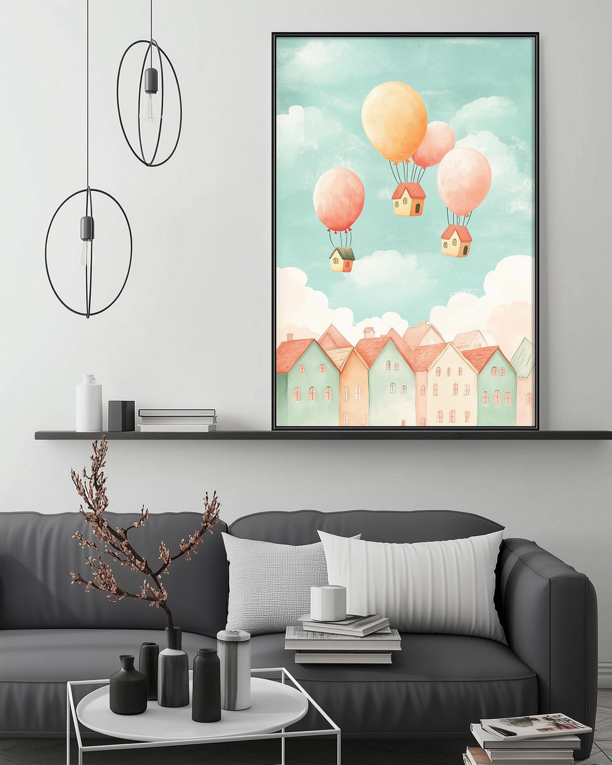 a cozy living room with a gray sofa, a coffee table, and a framed illustration of a whimsical town with hot air balloons floating above it.