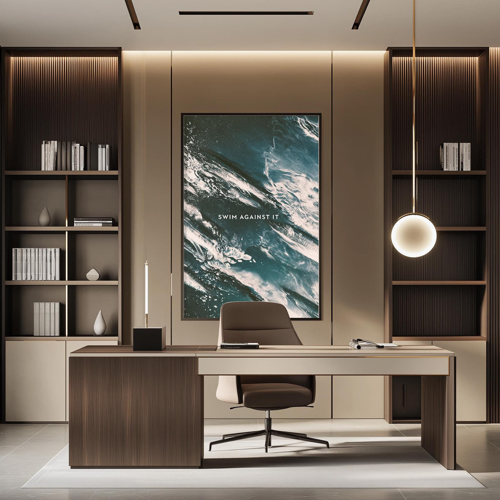 a modern and minimalist office space with a large wall-mounted poster, a wooden desk, and a comfortable-looking chair.