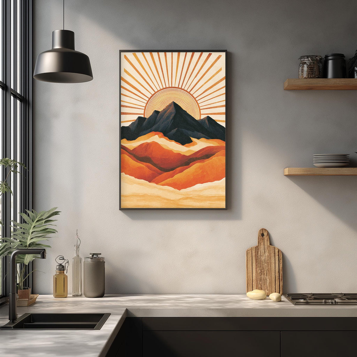 a kitchen counter with a framed landscape painting hanging above it, depicting a mountain range with a sun-like design in the background.