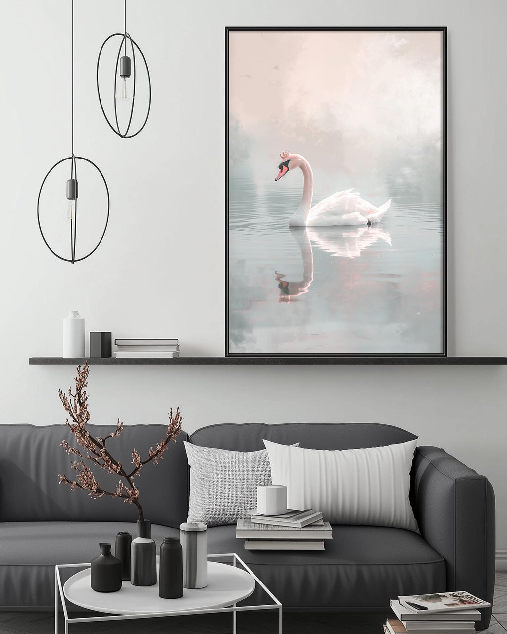 a large framed picture of a swan swimming in a pond, hanging on a wall above a gray couch with a coffee table in front of it.