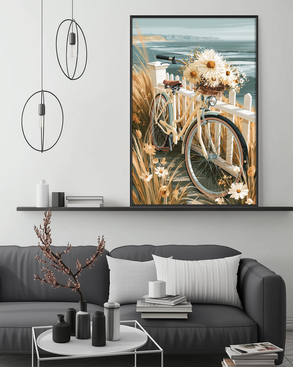 a cozy living room with a gray sofa, a coffee table, and a large framed painting of a bicycle with flowers on the wall above it.
