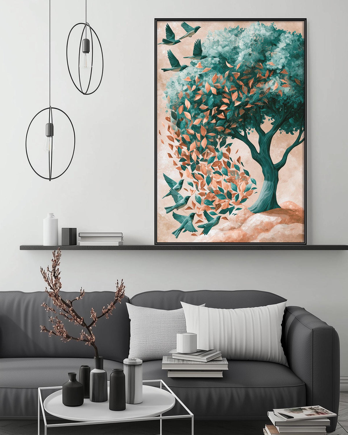 a modern living room with a gray sofa, a coffee table, and a large framed painting of a tree with birds on it. The painting is hanging on the wall above the sofa, creating a focal point in the room.