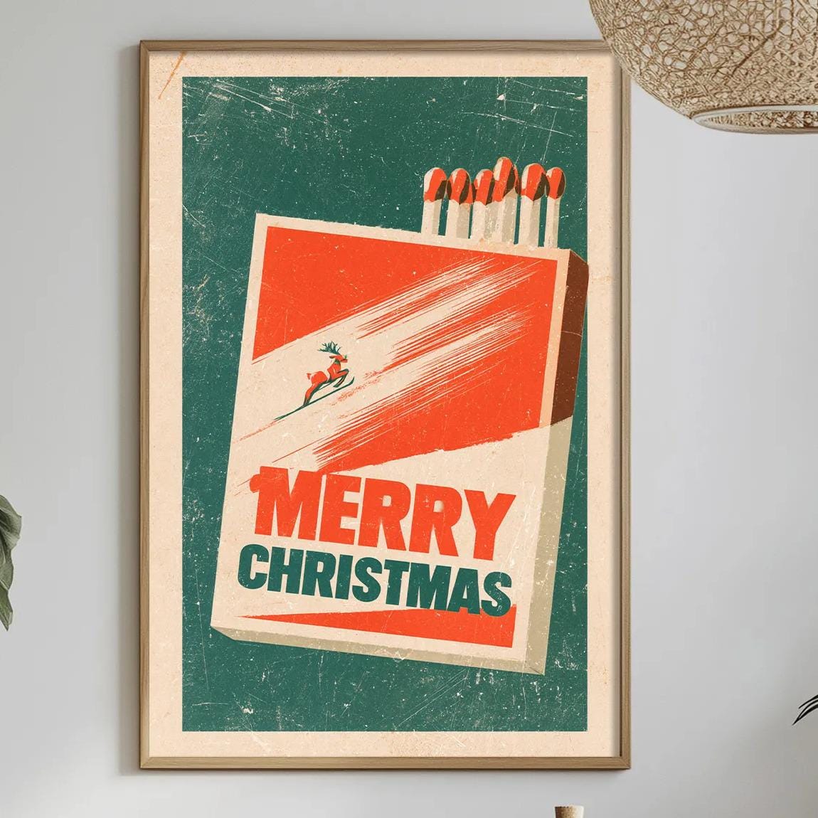 a framed poster with a Christmas-themed design hanging on a wall, surrounded by various decorative elements such as potted plants, vases, and a dining table with a bowl of fruit.